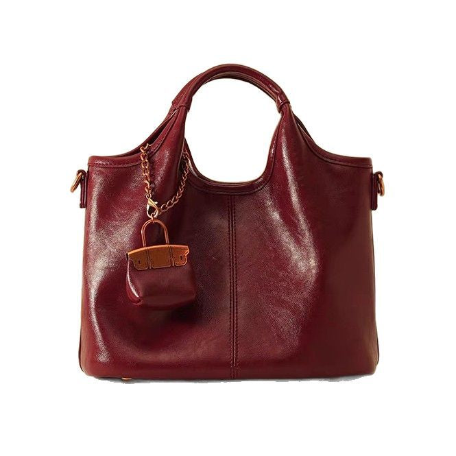 QARELA Red Glossy Leather Tote Bag – Elegant Large-Capacity Shoulder & Handbag for Work or Occasions Radiate confidence and charm with this bold red tote — a statement of modern elegance for workdays or special events.